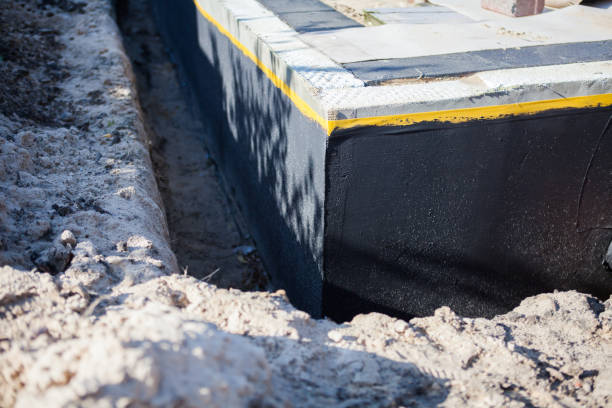 Professional Waterproofing technician working in Raymond, WA